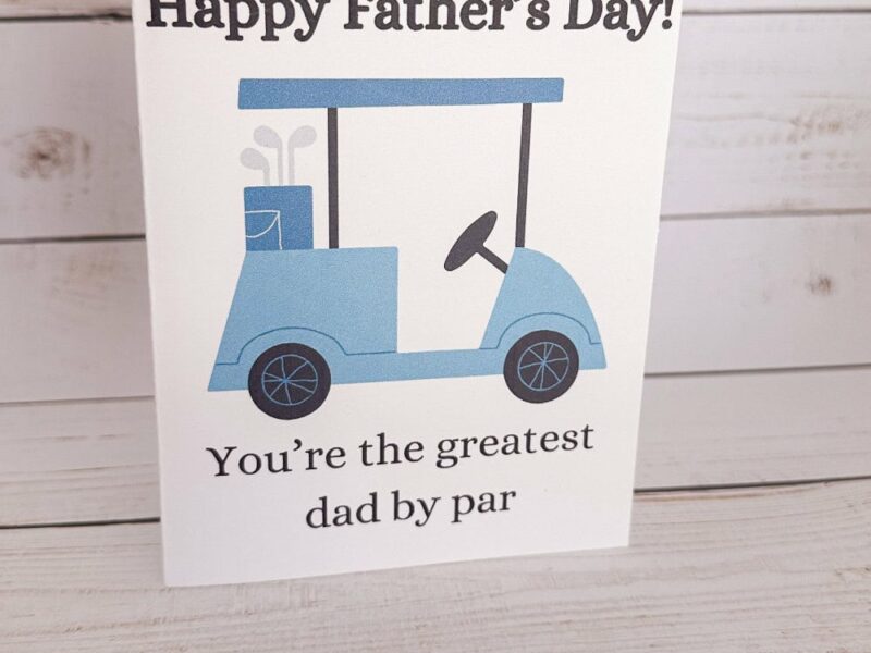 Golf Father's Day Card with a blue golf cart that says 'Happy Father's Day' and 'You're the greatest dad by par'
